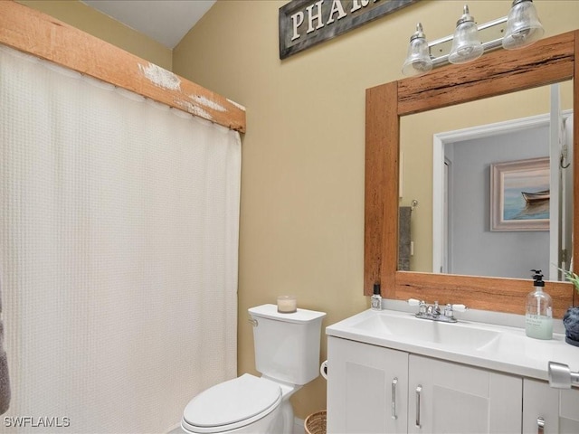 bathroom with toilet and vanity