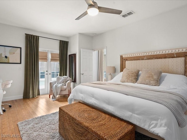 bedroom featuring ceiling fan, access to exterior, light hardwood / wood-style floors, and french doors