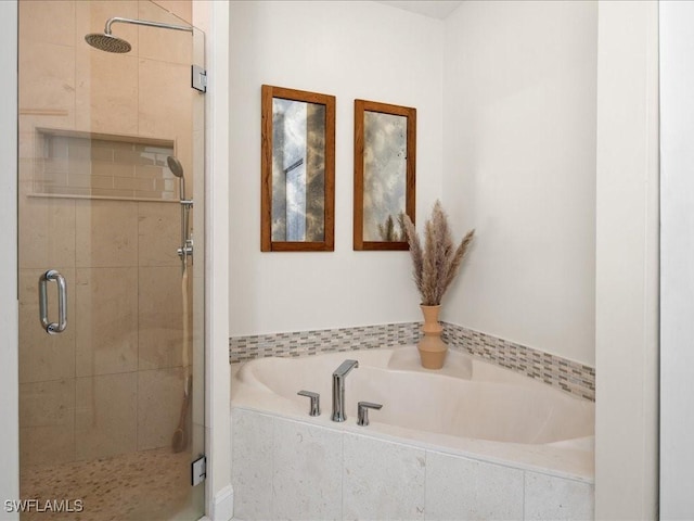 bathroom with shower with separate bathtub