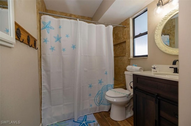 bathroom with toilet, a shower with shower curtain, and vanity