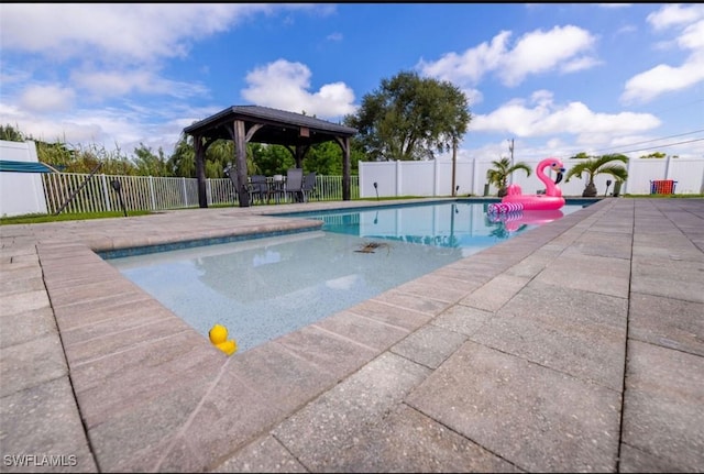 view of swimming pool featuring a patio area and a gazebo