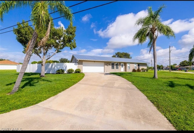 single story home with a garage and a front lawn