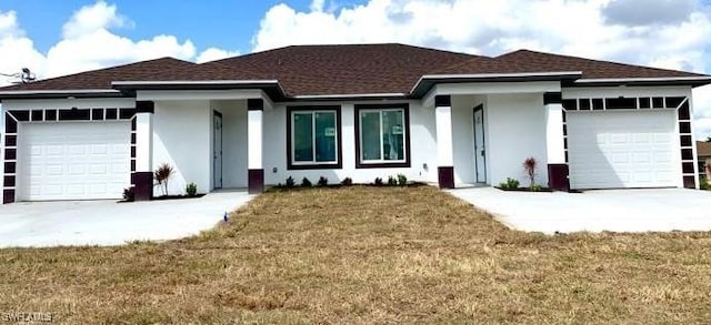 view of front facade with a front lawn and a garage