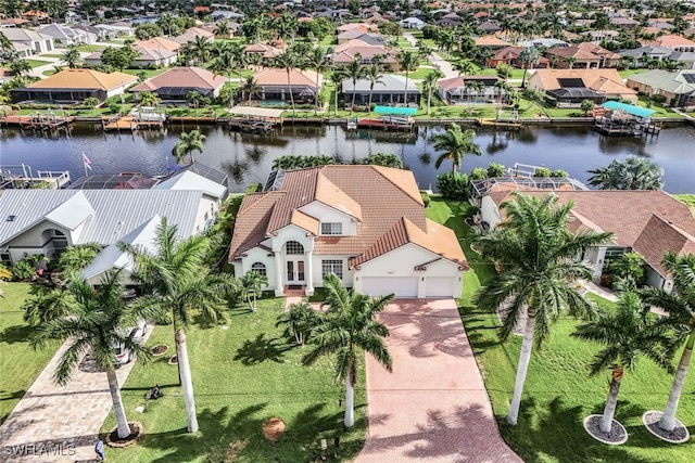 birds eye view of property with a water view