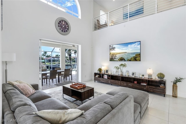 tiled living room featuring a high ceiling