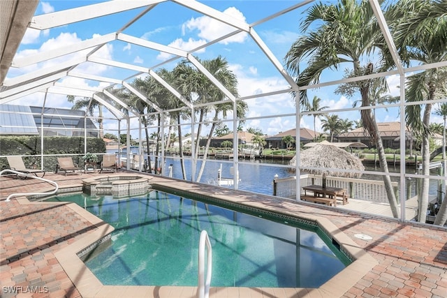 view of swimming pool featuring an in ground hot tub, a water view, a lanai, and a patio