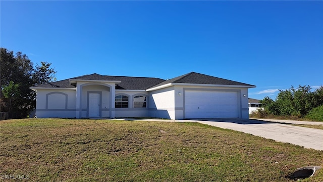 ranch-style house with a garage and a front yard