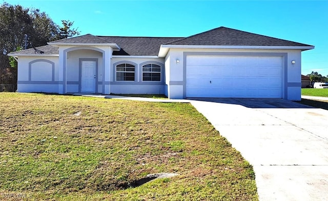 ranch-style house featuring a garage and a front yard