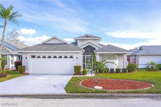 view of front of property featuring a garage and a front lawn