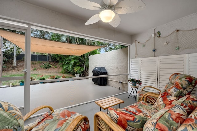 sunroom / solarium with ceiling fan