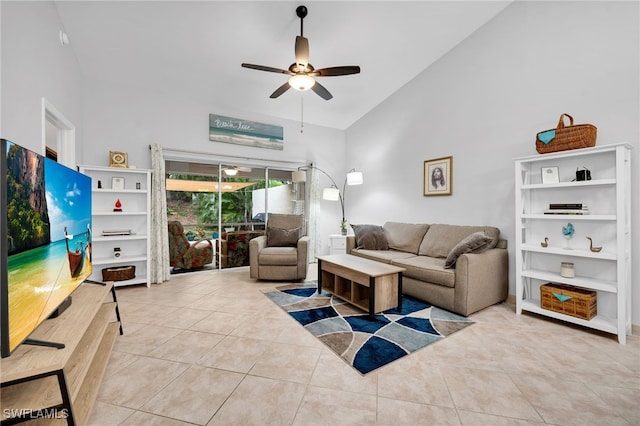 living room featuring ceiling fan, light tile patterned floors, and high vaulted ceiling