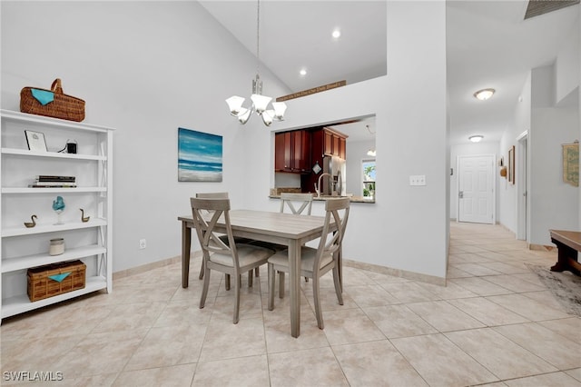 dining room featuring high vaulted ceiling, light tile patterned floors, and a notable chandelier