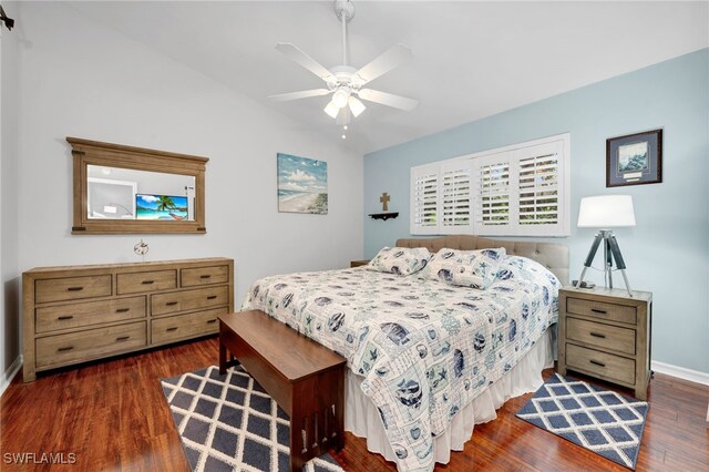 bedroom with ceiling fan and dark wood-type flooring