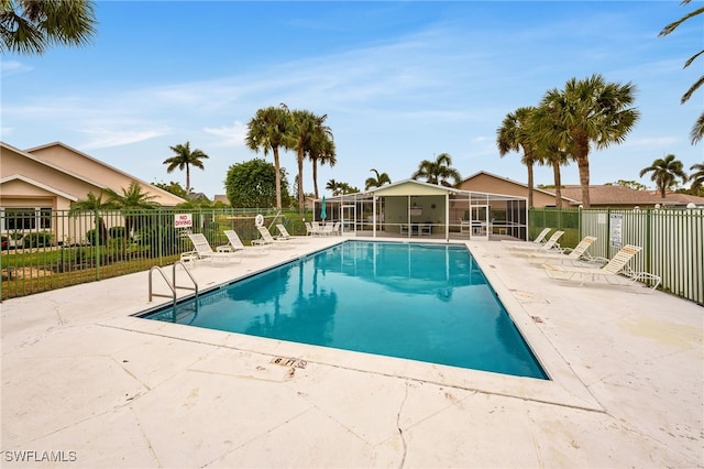 view of swimming pool featuring a patio area