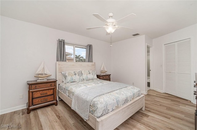 bedroom featuring a closet, ceiling fan, and light hardwood / wood-style flooring