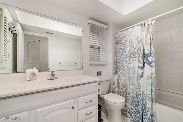 full bathroom featuring vanity, shower / bath combination with curtain, and toilet