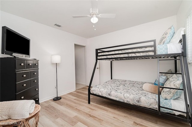 bedroom with light wood-type flooring and ceiling fan