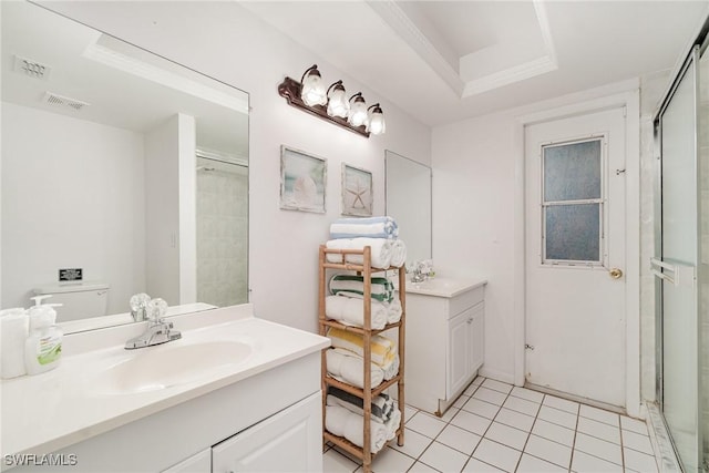 bathroom with vanity, tile patterned floors, and walk in shower