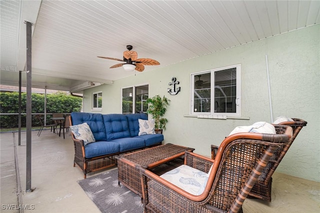 view of patio with an outdoor living space and ceiling fan