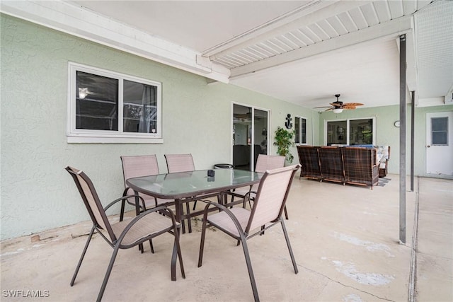 view of patio with an outdoor living space and ceiling fan