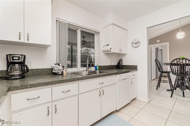 kitchen with sink, dishwasher, white cabinetry, light tile patterned flooring, and decorative light fixtures