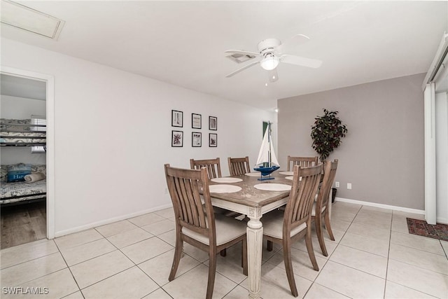 dining space featuring light tile patterned floors and ceiling fan