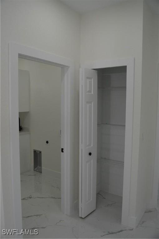 bathroom featuring marble finish floor