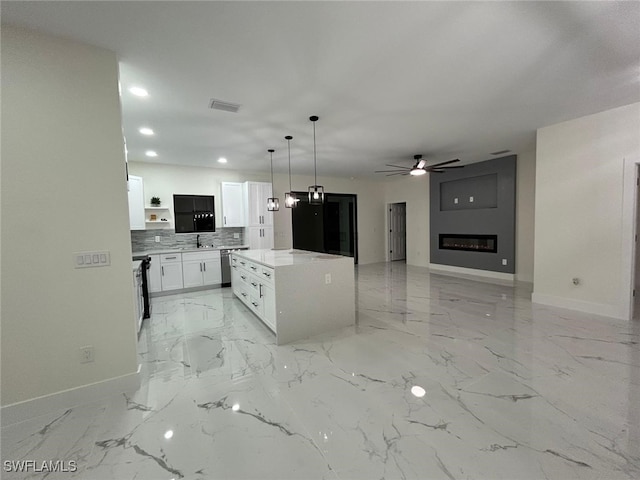 kitchen with open shelves, visible vents, stainless steel dishwasher, white cabinetry, and baseboards