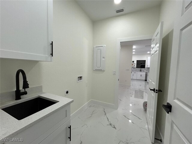 laundry room with visible vents, marble finish floor, hookup for an electric dryer, washer hookup, and a sink