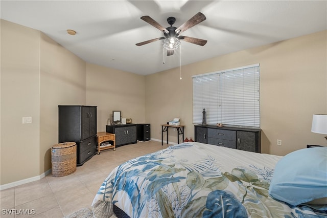 tiled bedroom with ceiling fan