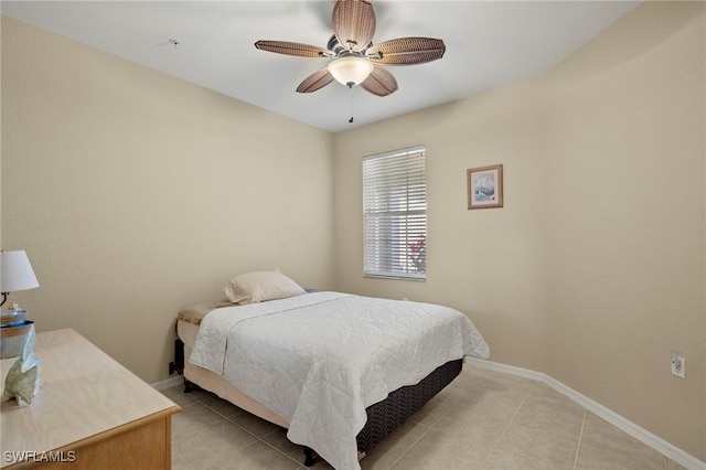 bedroom featuring light tile patterned floors and ceiling fan