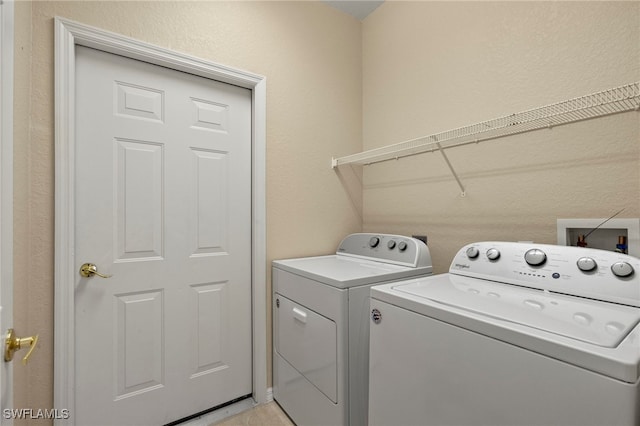 laundry area with washing machine and dryer