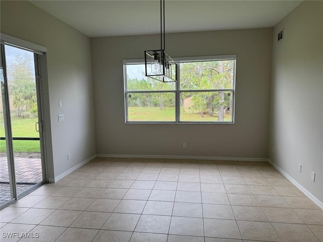 unfurnished dining area with a wealth of natural light and light tile patterned floors