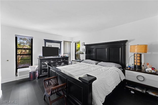 bedroom featuring dark wood-type flooring