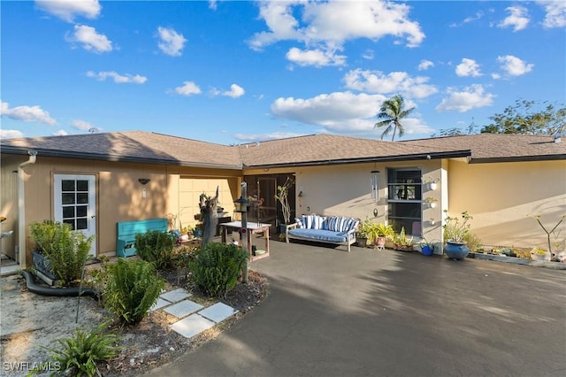 rear view of house with a patio