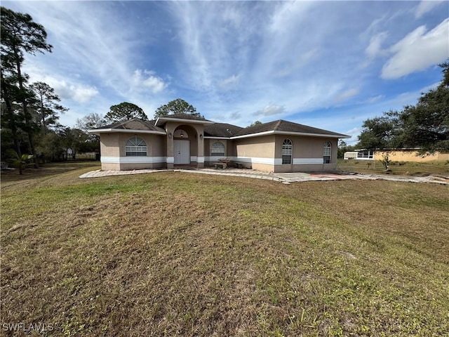 view of front of home with a front yard