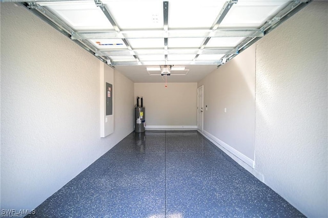 garage featuring a garage door opener, electric panel, and water heater