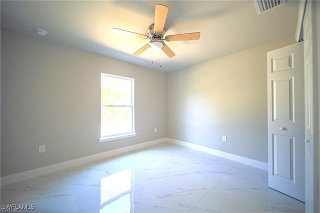 unfurnished room with ceiling fan