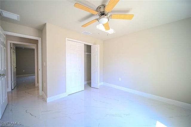 unfurnished bedroom with ceiling fan and a closet