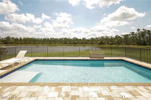 view of swimming pool featuring a water view