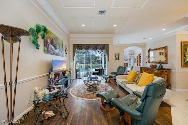 living room featuring crown molding and hardwood / wood-style floors