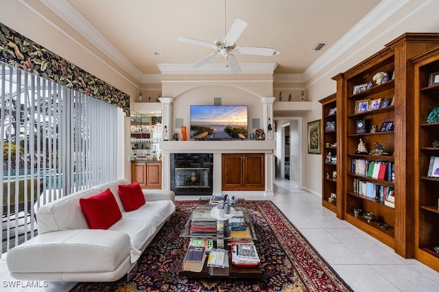 tiled living room featuring ceiling fan and ornamental molding