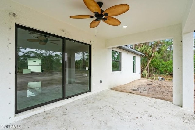 view of patio featuring ceiling fan