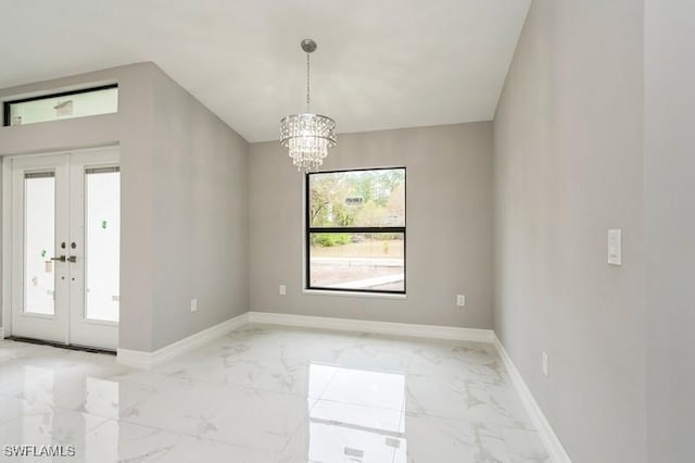 interior space featuring an inviting chandelier, french doors, and a healthy amount of sunlight