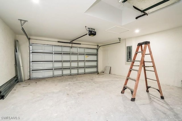 garage with electric panel and a garage door opener