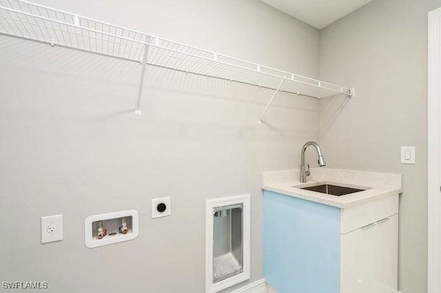 clothes washing area featuring sink, hookup for a washing machine, and electric dryer hookup