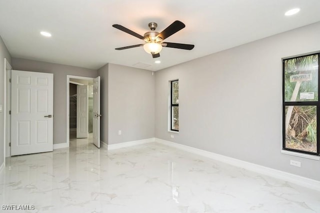 spare room with ceiling fan