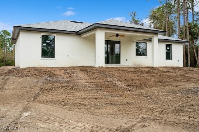 back of property featuring ceiling fan