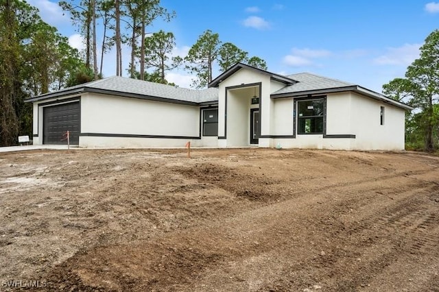 view of front of property with a garage