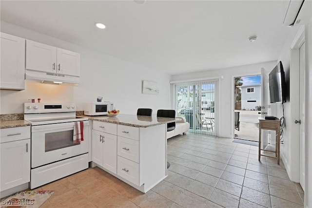 kitchen featuring light stone counters, white appliances, white cabinets, and light tile patterned flooring